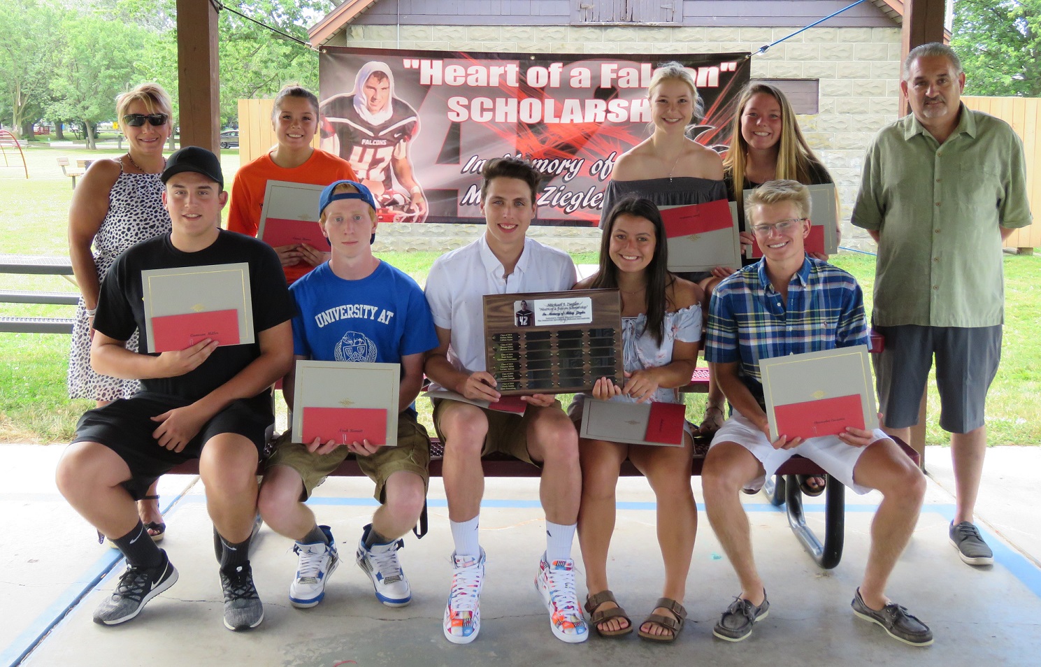 The 2019 `Heart of a Falcon` scholarship winners, along with Krista and Mark Ziegler. 